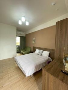 Voodi või voodid majutusasutuse 屏東潮州民宿-綠品文旅Green Inn toas