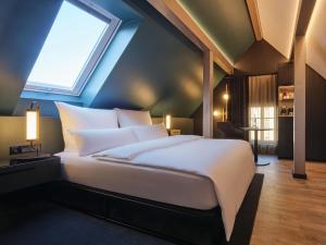 Postel nebo postele na pokoji v ubytování Hotel am Sophienpark
