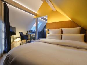 Postel nebo postele na pokoji v ubytování Hotel am Sophienpark