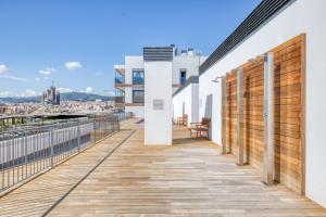 a balcony with a view of the city at Blueground Poblenou pool nr Glories BCN-37 in Barcelona