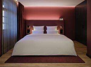 Postel nebo postele na pokoji v ubytování Hotel am Sophienpark