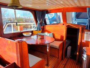 a small table in the back of a boat at Motorjacht Flint in Amsterdam