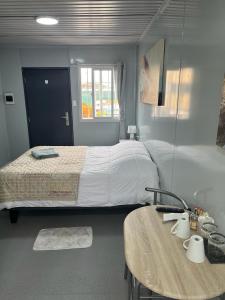 Ένα ή περισσότερα κρεβάτια σε δωμάτιο στο Residencial Oasis Container