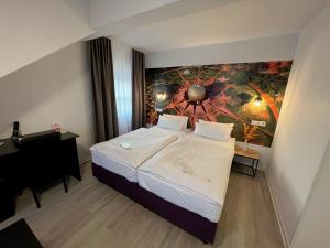 Кровать или кровати в номере Hotel Bitzer Backnang