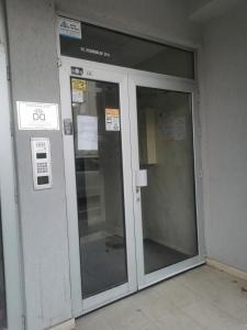 an entrance to a building with two glass doors at The Loft in Kumanovo