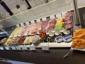 a display case with many different types of food at Hotel Bitzer Backnang in Backnang