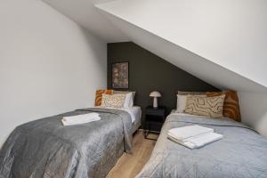 Cama o camas de una habitación en Best Possible Location-Laugavegur Luxury Loft