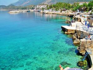 a view of a body of water with a beach at Aqua Princess Hotel in Kaş