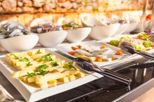 a buffet with several plates of food on a table at Aquarius Hotel in Kaş