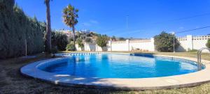Bazén v ubytovaní Tabarca - Chalet con jardín y piscina comunitaria alebo v jeho blízkosti