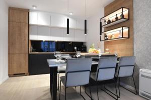 a kitchen with a dining room table and chairs at K&P - Zadar Luxurious Retreat - BRAND NEW !! in Zadar