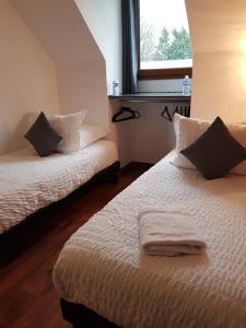 Ein Bett oder Betten in einem Zimmer der Unterkunft chambres et gites d'étretat