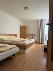 Postel nebo postele na pokoji v ubytování Apartmány Telgárt