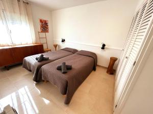 Posteľ alebo postele v izbe v ubytovaní Charming apartment in La Fosca Beach