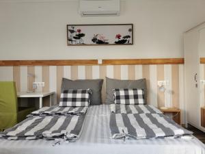 Postel nebo postele na pokoji v ubytování Duna Riverside