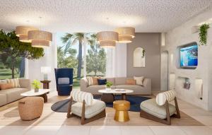 sala de estar con sofá, mesa y sillas en Résidence Prestige Odalys Le Riviera, en Hyères