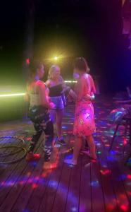 a group of people standing on a dance floor at Happy Bottom Riverfront Cabin, Petersburg,WV in Rig