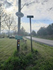 a street signs on the side of a road at Happy Bottom Riverfront Cabin, Petersburg,WV in Rig