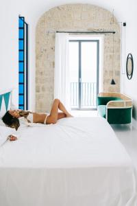 เตียงในห้องที่ Miramare Sea Resort & Spa