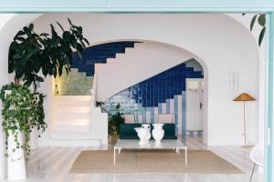 a living room with a table with vases on it at Miramare Sea Resort & Spa in Ischia