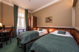 Posteľ alebo postele v izbe v ubytovaní Hotel Hastal Prague Old Town