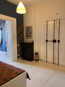 a bedroom with a bed and a closet and a door at Casa Benso - near Vatican City and Navona Square in Rome