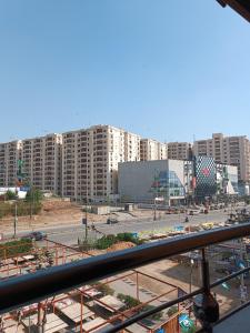 a view of a city with tall buildings and a street at Luxury Living Rooms in Karachi