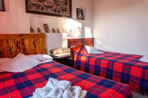 Zimmer mit 2 Betten in einem Zimmer in der Unterkunft La casa del colobri in Cotacachi