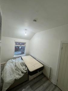 Säng eller sängar i ett rum på 34 Green Arbour Road