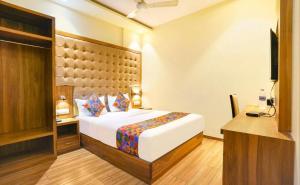 En eller flere senge i et værelse på Cozy Inn T2 Mumbai Airport