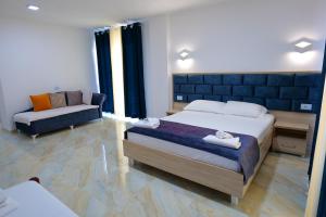 Postel nebo postele na pokoji v ubytování Hotel Vathi