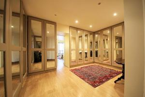 a large room with glass doors and a red rug at Eiffel Tower Paris in Paris +3 photos