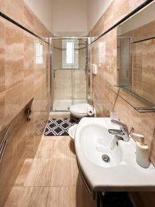 a bathroom with a sink and a toilet at La Casa di Eli in Pisa