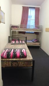 Postel nebo postele na pokoji v ubytování Elizabeth Hostel