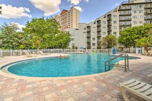 een zwembad in het midden van een gebouw bij Resort-Style Orlando Studio Steps to Beach! in Orlando