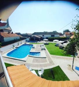 a view of a large swimming pool in a yard at Bibex Komplex in Gornje Međurovo