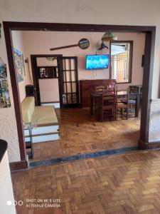 a living room with a table and a dining room at Pousada San Salvador in Salvador