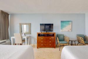 a hotel room with two beds and a television at Bayside at Sandestin #6580 in Destin