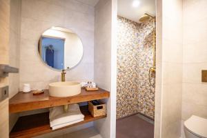 a bathroom with a sink and a shower at Les Nuits de Thoiry in Thoiry +33 photos