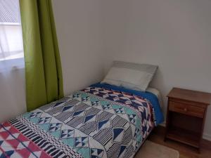 En eller flere senge i et værelse på Casa Arriendo Diario