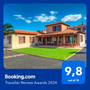 a house with a sign that says travel review awards at Casa Tagoro, facing the Ocean in Tacoronte