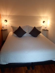 Ein Bett oder Betten in einem Zimmer der Unterkunft chambres et gites d'étretat
