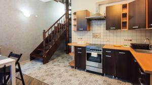 a kitchen with a sink and a stove top oven at Apartament II Gdańsk - Apartamenty w Górach i nad Morzem in Gdańsk