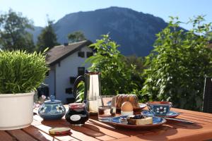 a wooden table with food on top of it at Ferienhaus Murmel in Ruhpolding