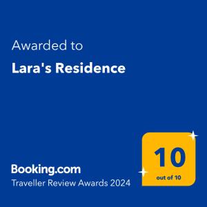 En logo, et sertifikat eller et firmaskilt på Lara's Residence