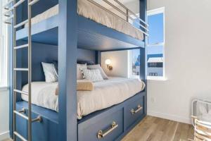 a bedroom with blue bunk beds in a room at Alpine Estate 3 Kitchens & Mountain Views in Buena Vista