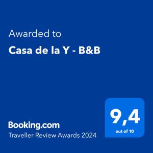 a blue text box with the words awarded to csa de la iv bbc at Casa de la Y - B&B in Encarnación