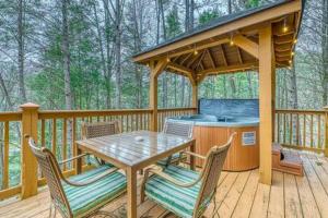 a wooden deck with a picnic table and a gazebo at Gatlinburg Home with Mountain Views in Gatlinburg