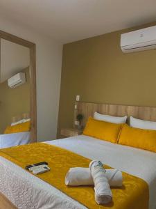 Een bed of bedden in een kamer bij HOTEL GRAN PARAISO