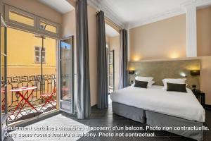 Rúm í herbergi á Hotel POZZO DI BORGO